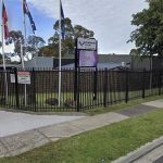 empty school gate in morning symbolizing broken sense of safety