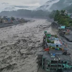 Nepal flood rescue crews clearing debris near a damaged hydropower tunnel after deadly Himalayan flooding